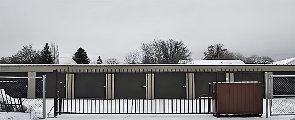 The fenced perimeter and security gate at the entrance to 3rd Avenue Storage